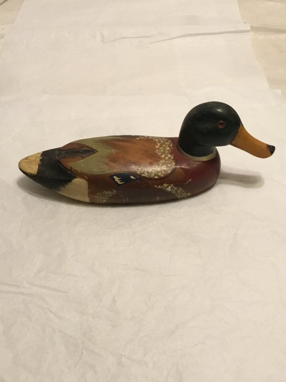 Vintage old wooden duck decoy with glass eyes